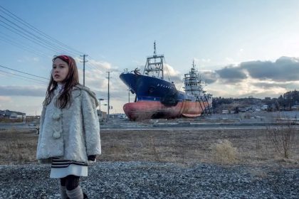 Wisata Jepang dan Bencana Alam: Siap Menghadapi Terburuk 40 A Girl Stands in Front of a Ship that was Grounded on March 11