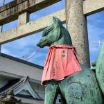 A Fox Statue Torii Gate at Toyokawa Inari
