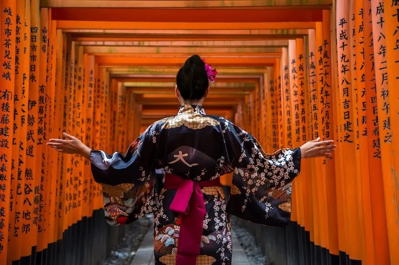 A Woman in a Kimono Visits a Shrine in Japan